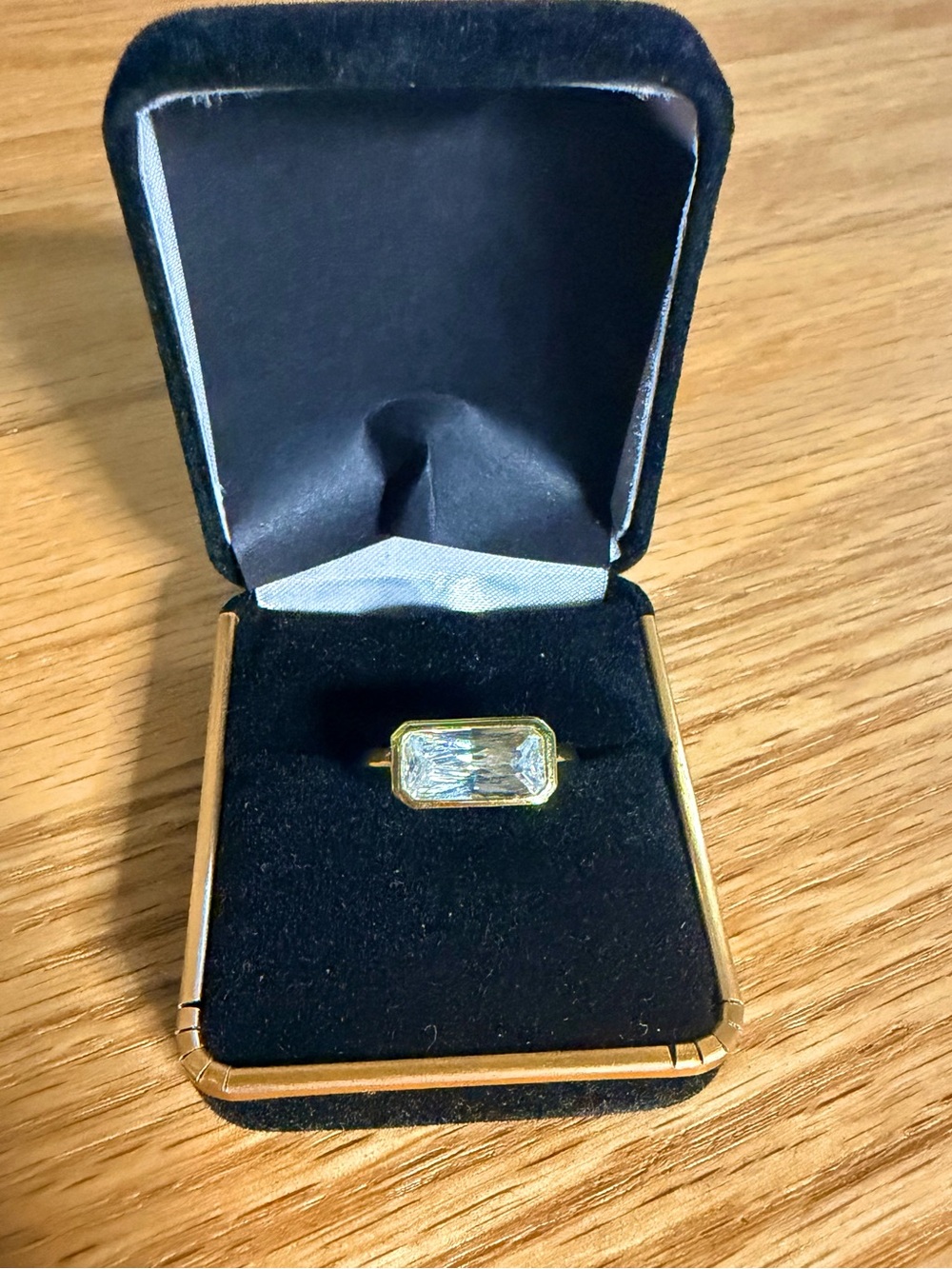 Size 6 gold plated ring with emerald cut CZ stone